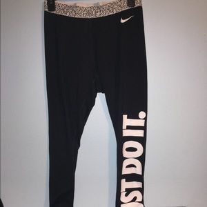 Nike running pants with Just Do It on the leg